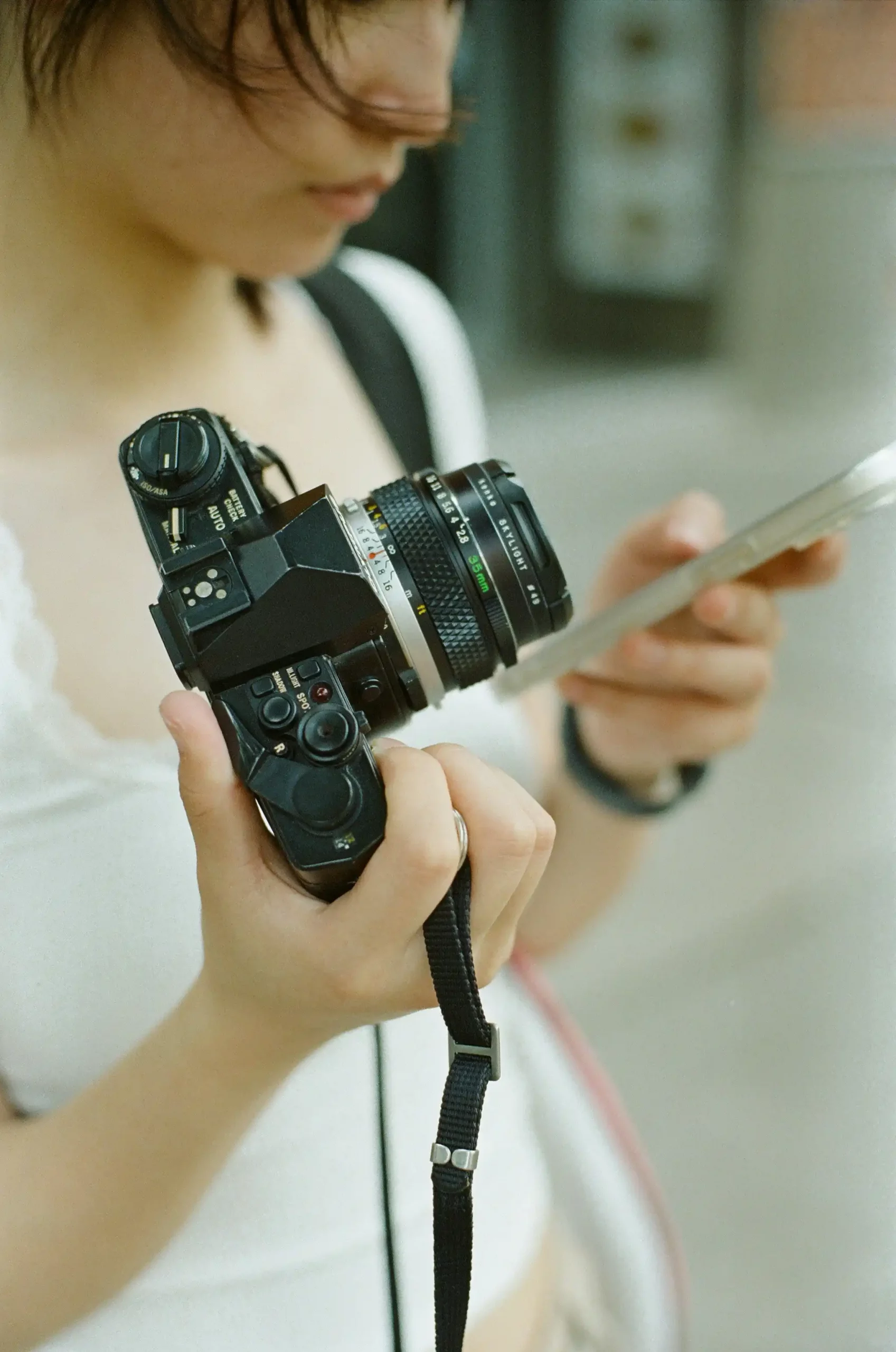 A camera resting on a wooden table, symbolizing learning a skill that lasts and capturing moments to cherish.