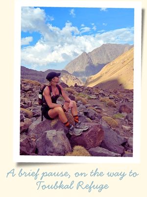 Resting while climbing Mount Toubkal on a Morocco travel itinerary
